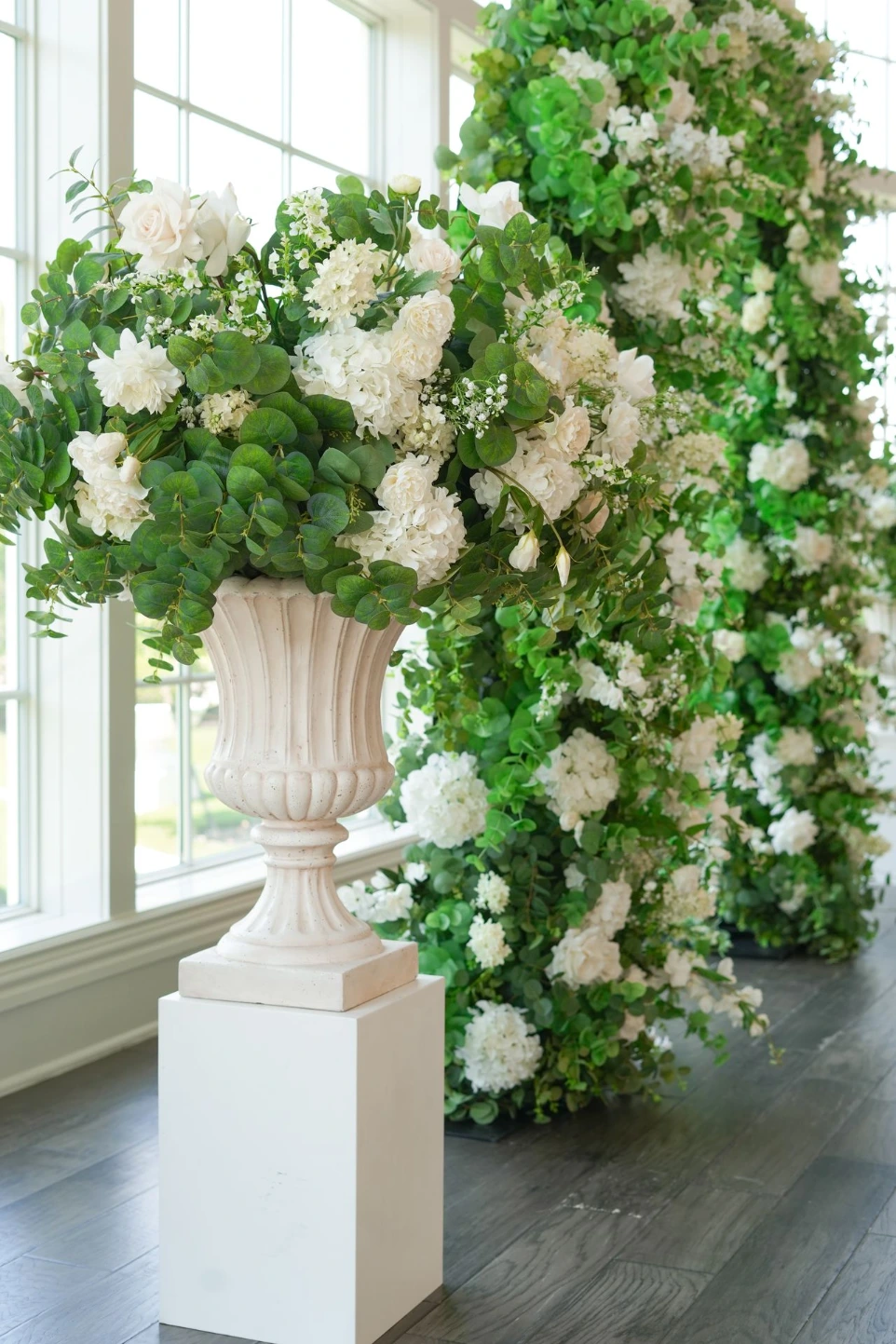 Lush silk greenery and white floral installation from Sherpa’s luxury wedding floral rentals in DFW, designed for balanced proportions and a polished, upscale finish.